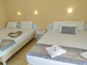 A bed or beds in a room at Celeste Golden Beach