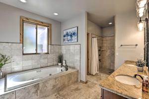 a large bathroom with a tub and a shower at Cabin with Game Room and Mtn Views in Silverthorne! in Silverthorne +24 photos