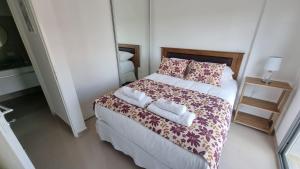Un pat sau paturi într-o cameră la Nice Patagonia Inn