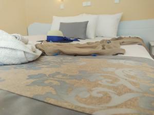 A bed or beds in a room at Celeste Golden Beach