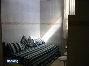 Cama o camas de una habitación en Apartamento Botafogo