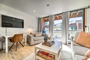 a living room with a couch and a table at Tahoe Donner Studio with Private Balcony! in Truckee