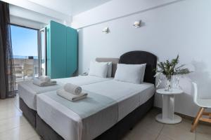 Postel nebo postele na pokoji v ubytování Coral Hotel
