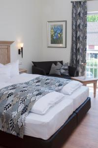 Postel nebo postele na pokoji v ubytování Hotel Zum Schlössle