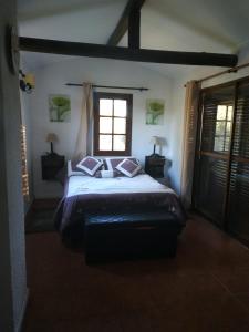 En eller flere senge i et værelse på Paraíso Serrano