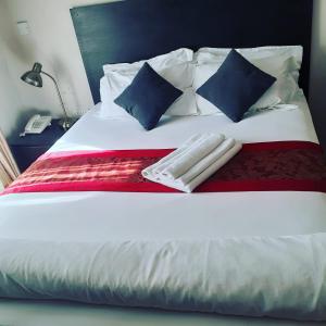 Postel nebo postele na pokoji v ubytování Magville Guest House