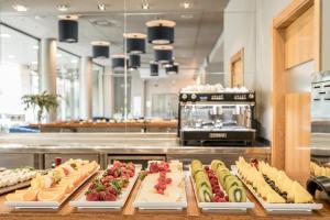 a buffet line with many different types of sandwiches at Hotel Antik San Sebastián in Donostia-San Sebastián