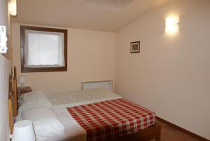 Cama ou camas em um quarto em Fattoria Villa Curti