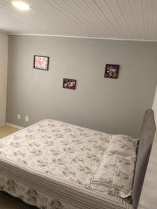 Säng eller sängar i ett rum på Hospedagem dona Tania