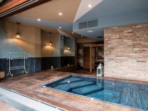 a large swimming pool in the middle of a house at Accademia al Colle in Bologna