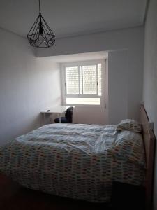 Un pat sau paturi într-o cameră la Torresmar home