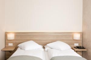 Postel nebo postele na pokoji v ubytování Hôtel de Chailly