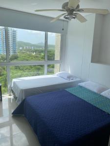 Кровать или кровати в номере Apartamento Santa Marta