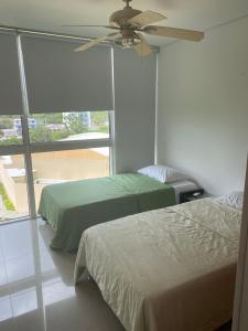 เตียงในห้องที่ Apartamento Santa Marta