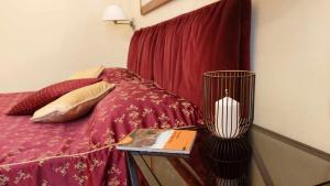 Ένα ή περισσότερα κρεβάτια σε δωμάτιο στο Tornabuoni La Petite Suite