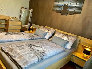 a bedroom with two beds and a mirror at Apartment Ani in Ramsau am Dachstein