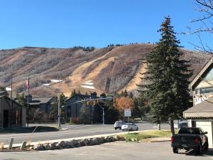 a street in a small town with a mountain at K B M Resorts- CBI-103 Upgraded 1Bd, wood fireplace, full kitchen, wifi, walk to slopes in Park City