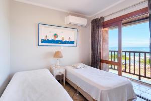 Ένα ή περισσότερα κρεβάτια σε δωμάτιο στο Vista Panorâmica do Mar - Praia Grande, Ubatuba SP +65 φωτογραφίες