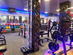 a gym with dumbbells and weights in a gym at Vacation Apartment Eilat in Eilat