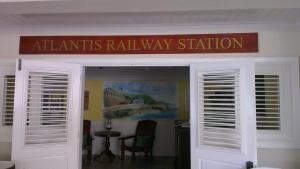 a sign over the entrance to an atantis rail way station at The Atlantis Historic Inn in Saint Joseph