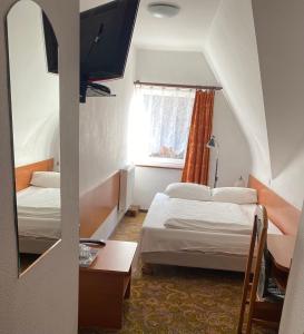 Łóżko lub łóżka w pokoju w obiekcie Hotel Górecki