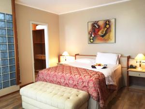 Posteľ alebo postele v izbe v ubytovaní Cosmos Hotel
