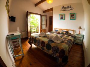 A bed or beds in a room at La Wave Surf House & School