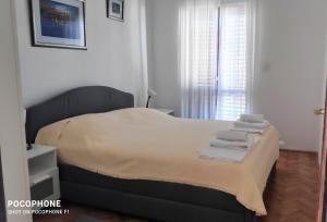 Postel nebo postele na pokoji v ubytování Apartments Tamaris