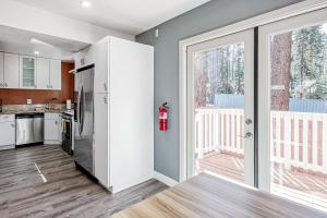 a kitchen with a sliding glass door and a fire hydrant at Ski Dock Holiday in Glenbrook