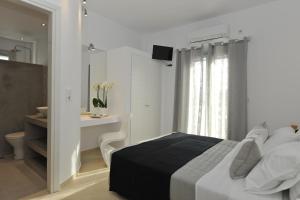 Posteľ alebo postele v izbe v ubytovaní Romantica Suites
