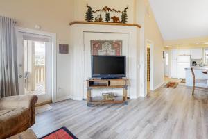a living room with a flat screen tv on a table at Aspenwood 4250 in Pagosa Springs