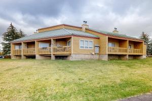 a large house with a large yard in front of it at Aspenwood 4250 in Pagosa Springs