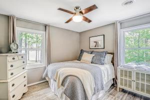 a bedroom with a bed and a ceiling fan at Base Camp D in Glenora