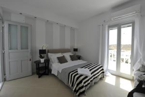 Posteľ alebo postele v izbe v ubytovaní Romantica Suites
