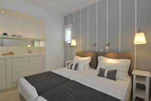 Posteľ alebo postele v izbe v ubytovaní Romantica Suites