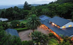an aerial view of a house with solar panels on it at Mountain Sanctuary B&B in Mount Tamborine