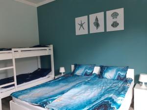 Posteľ alebo postele v izbe v ubytovaní Ta'karos apartman