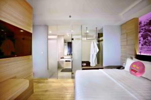 Postel nebo postele na pokoji v ubytování favehotel Cimanuk Garut