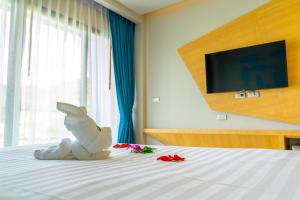 Postel nebo postele na pokoji v ubytování Golden Paradise Hotel - SHA PLUS