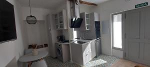 Kuchyň nebo kuchyňský kout v ubytování LA CASITA