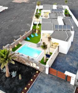 an aerial view of a house with a swimming pool at Sea Breeze Villas in Playa Blanca