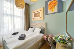 Posteľ alebo postele v izbe v ubytovaní Kalina Apartments
