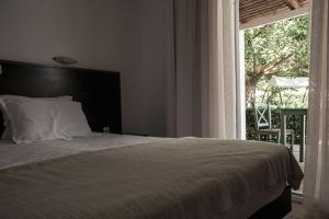 Letto o letti in una camera di Ecoresort Hotel Zefyros