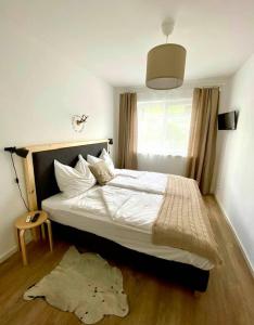 Кровать или кровати в номере App. Seyrl im Haus Karoline