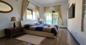 Tempat tidur dalam kamar di Villa del Mar