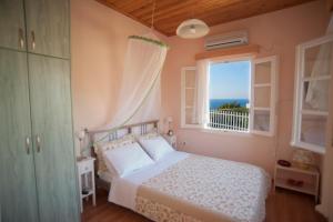 A bed or beds in a room at Deep Blue-Daphne Agios Nikitas