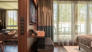 TV a/nebo společenská místnost v ubytování Innspire Hotel