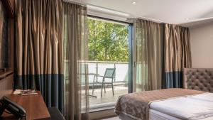 Postel nebo postele na pokoji v ubytování Innspire Hotel