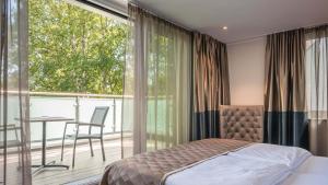 Postel nebo postele na pokoji v ubytování Innspire Hotel