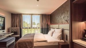 Postel nebo postele na pokoji v ubytování Innspire Hotel